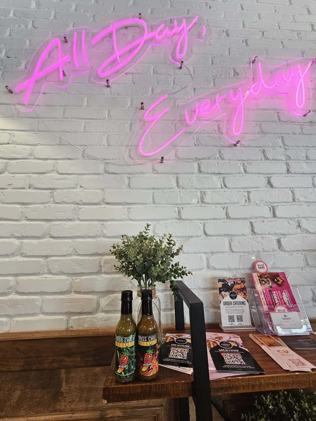 Miss Chili hot sauce bottles arranged on a retail counter display