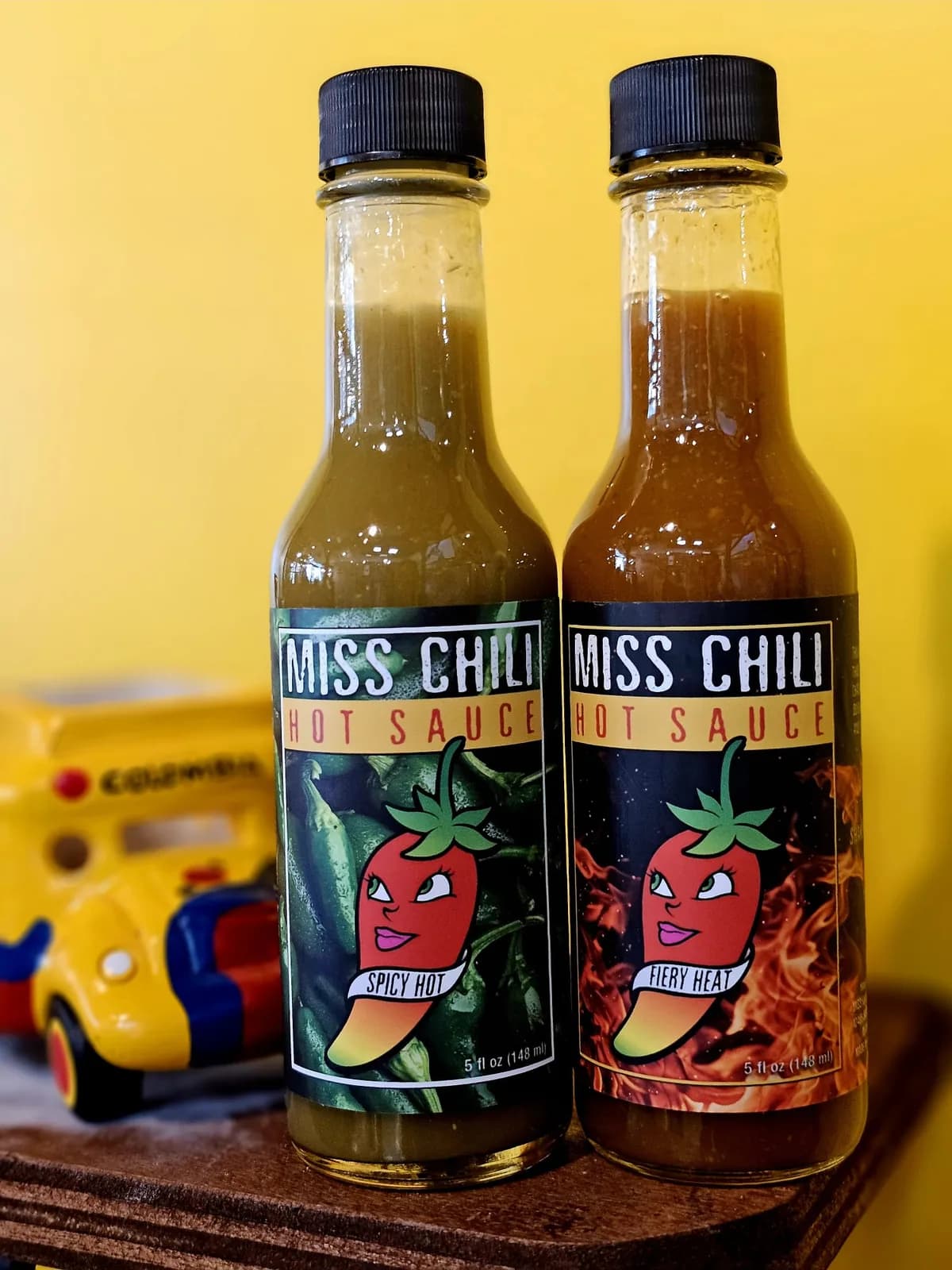 Miss Chili Spicy Hot and Fiery Heat bottles together
